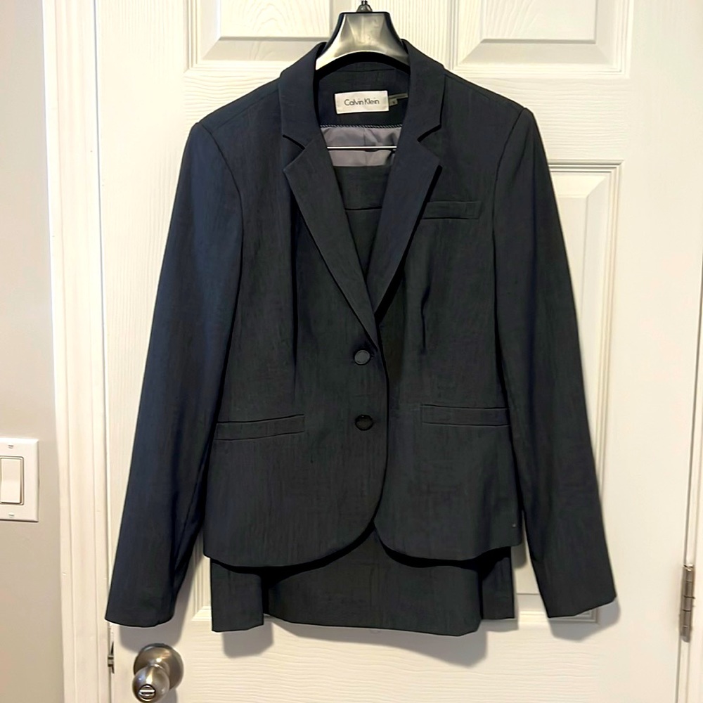 Dark grey business suit. Size 8 Calvin Klein
